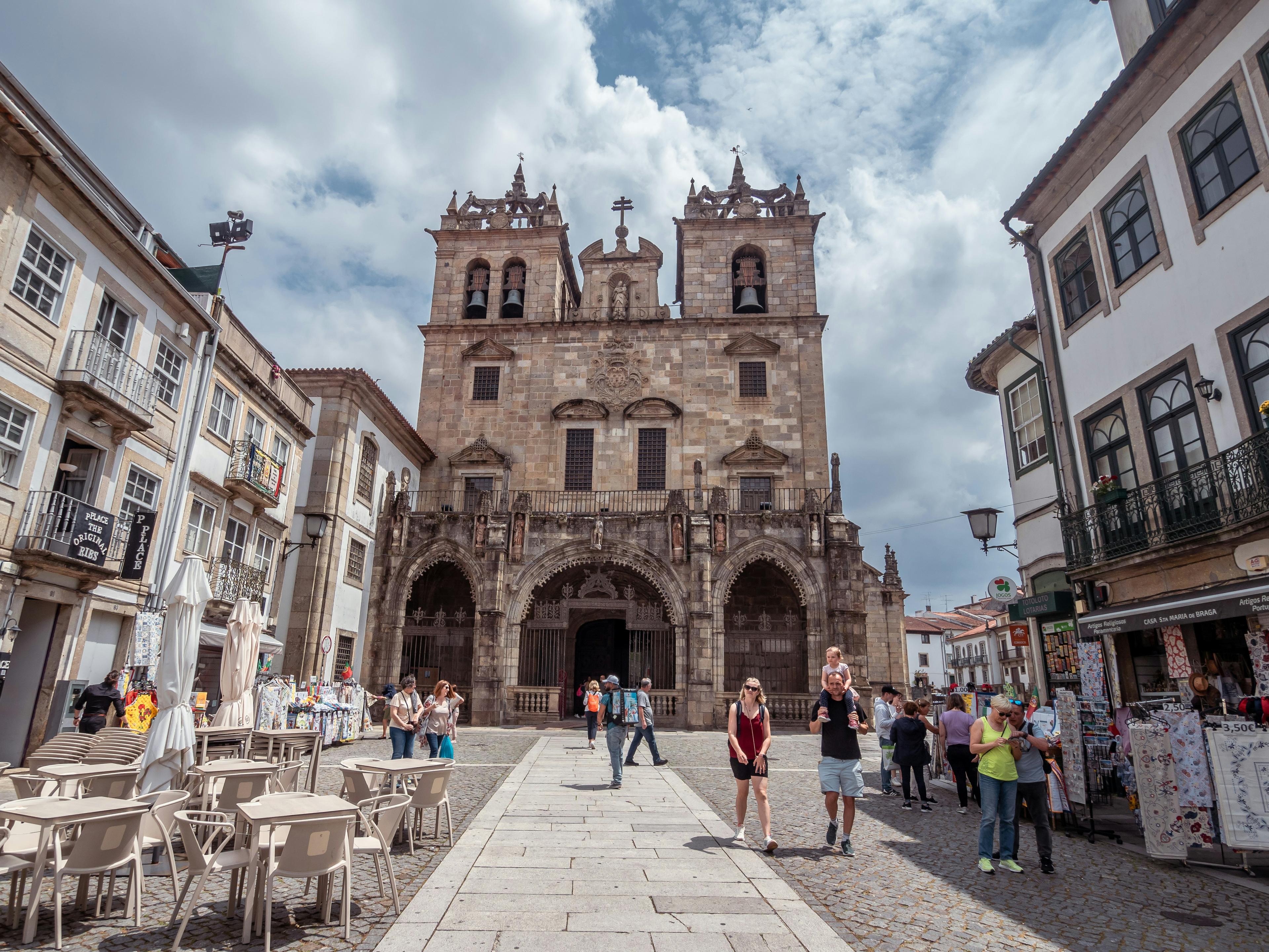 Braga pedestrian street lined with tall stone buildings